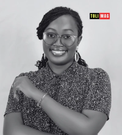 Portrait of Ann Irungu, African public health researcher, speaking at a climate and health conference — representing women’s scientific leadership in Africa